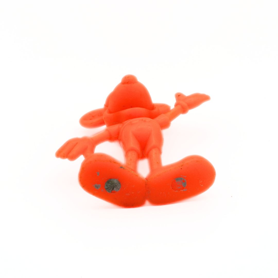 Orange plush toy resembling a mouse on a white background