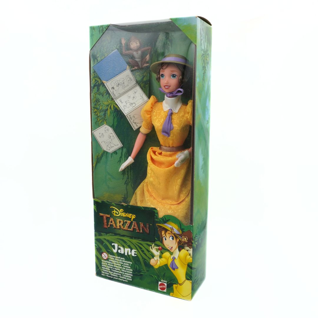 A 90s Jane doll from the Disney movie Tarzan, wearing a yellow dress with purple detailing