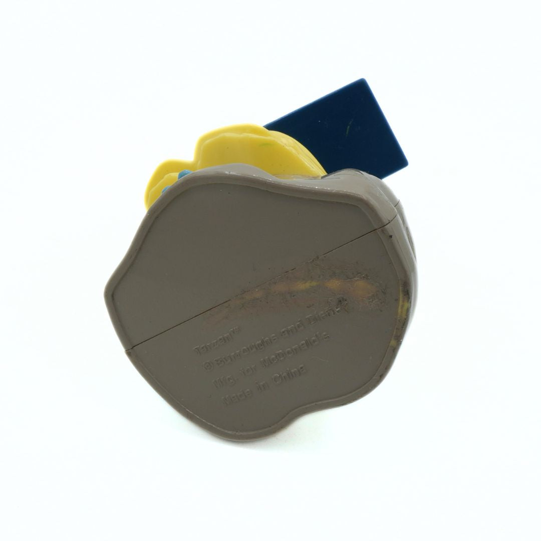 Close-up of a brown plastic object with text on a white background