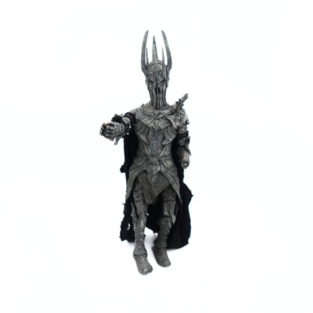 Photo of a 2002 Sauron figure from Lord of the Rings with his armour clad arm outstretched