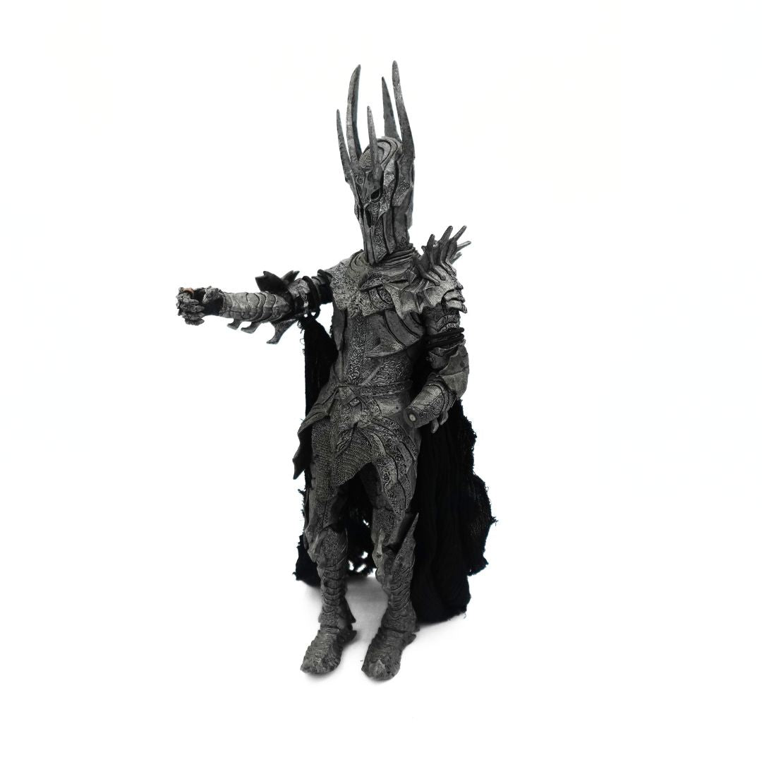 Photo of a 2002 Sauron figure from Lord of the Rings with his armour clad arm outstretched