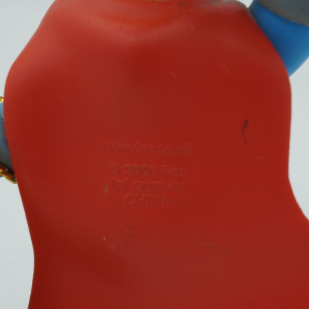 Close-up of a red container with text on a white background