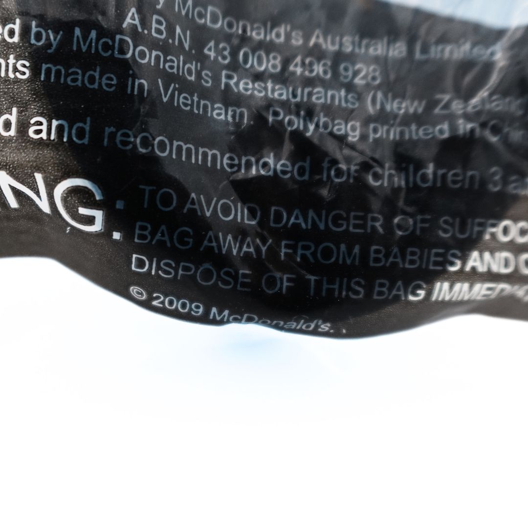 Close up of the safety information on the 2009 McDonalds Littlest Pet Shop Beauty Kit packaging