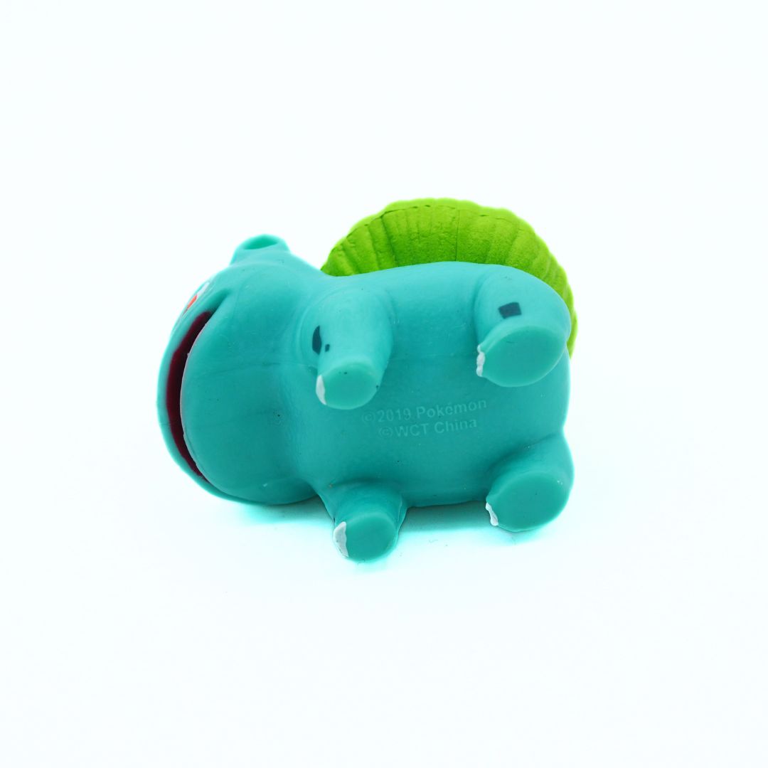 Teal and green toy on a white background