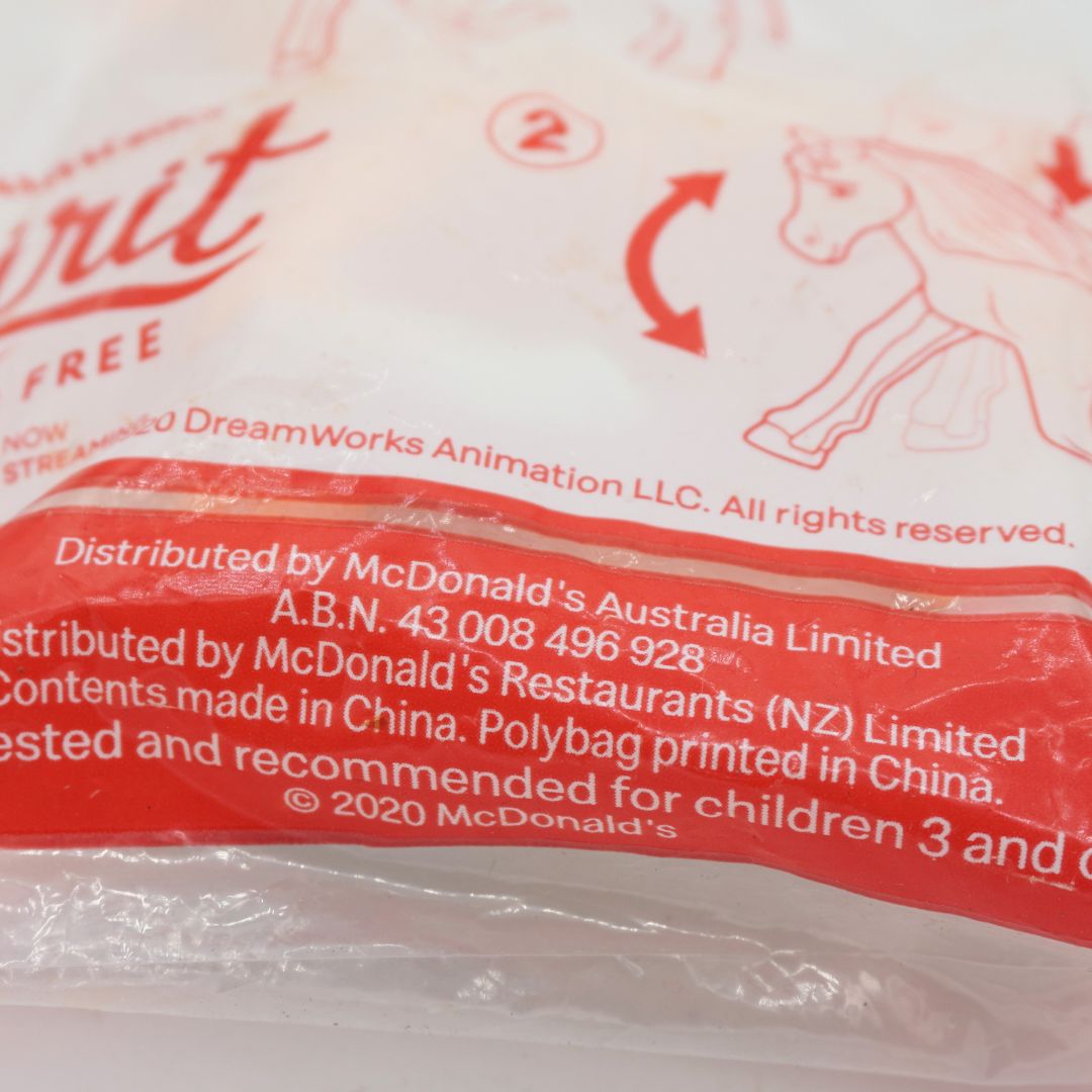 Close-up of a McDonald's branded plastic bag, showing red printed text and a horse outline on a white background.