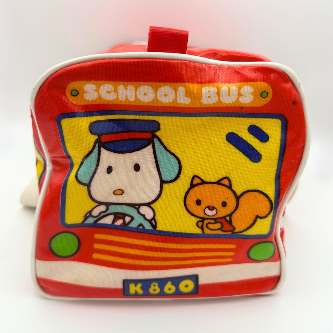 Side on image of a vintage mini Hello Kitty school bus themed duffle bag