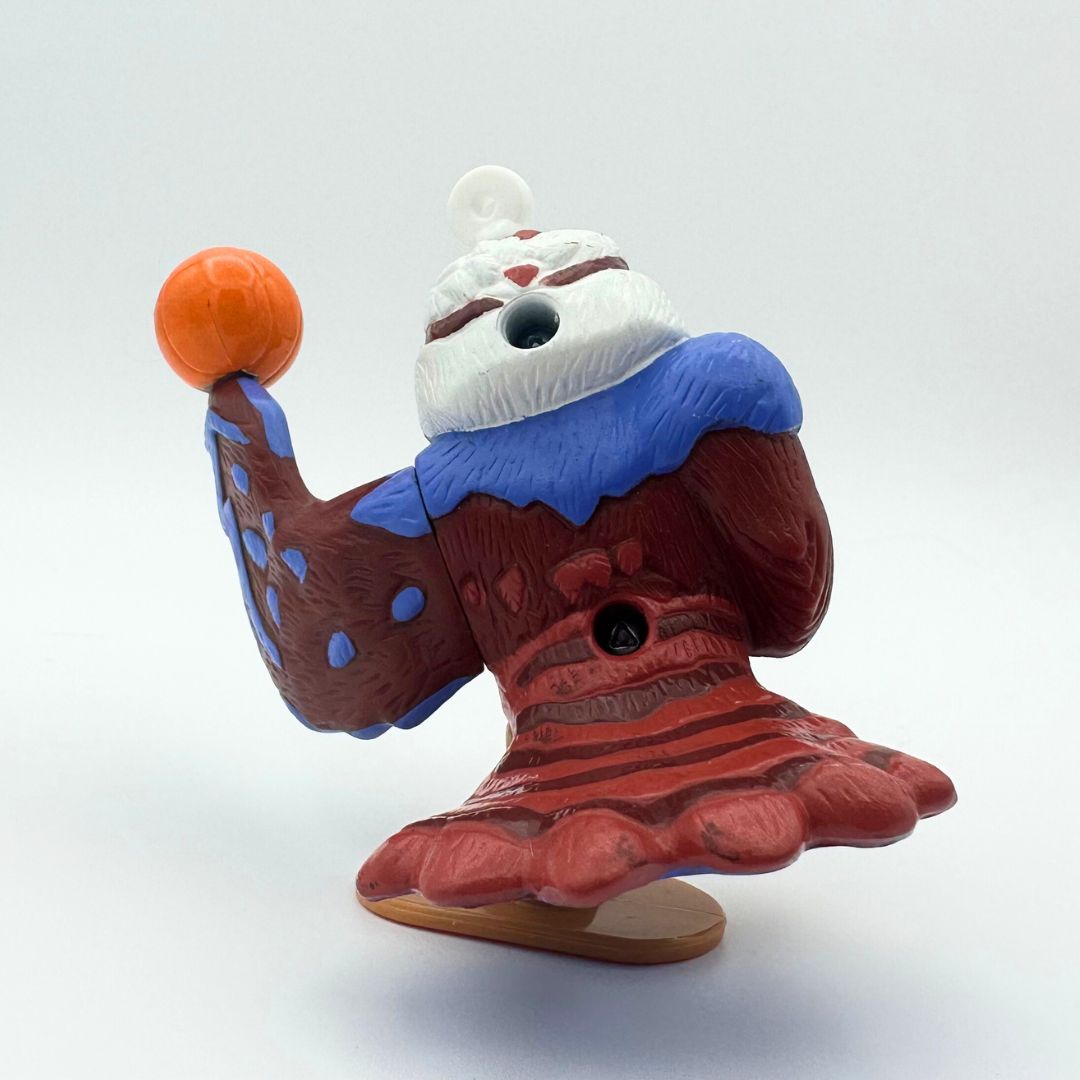 Photo of the back of Olly the kookaburra balancing a basketball