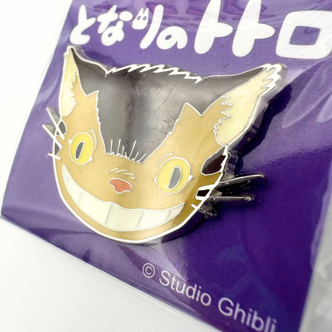 Close up of a metal Catbus pin