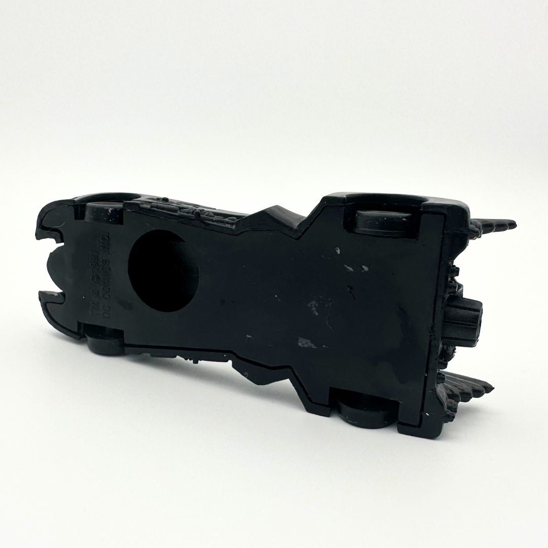 The underside of a vintage Batman toy car