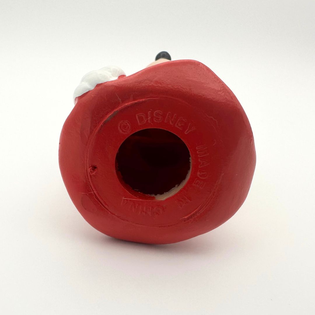 The underside of a vintage rubber Minnie Mouse figure