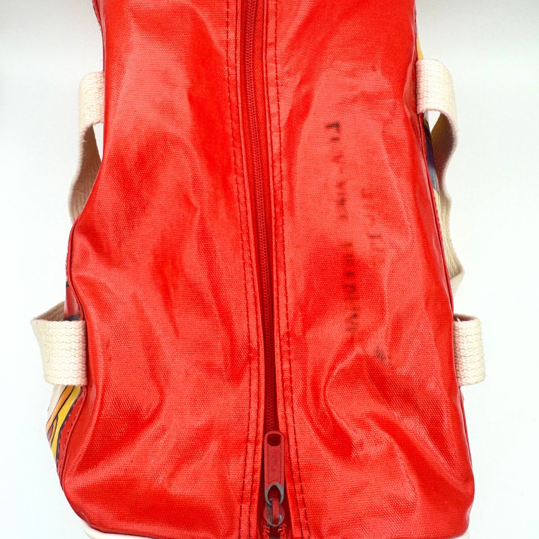 Top down image of a red vintage Sanrio Hello Kity bag from the 1970's