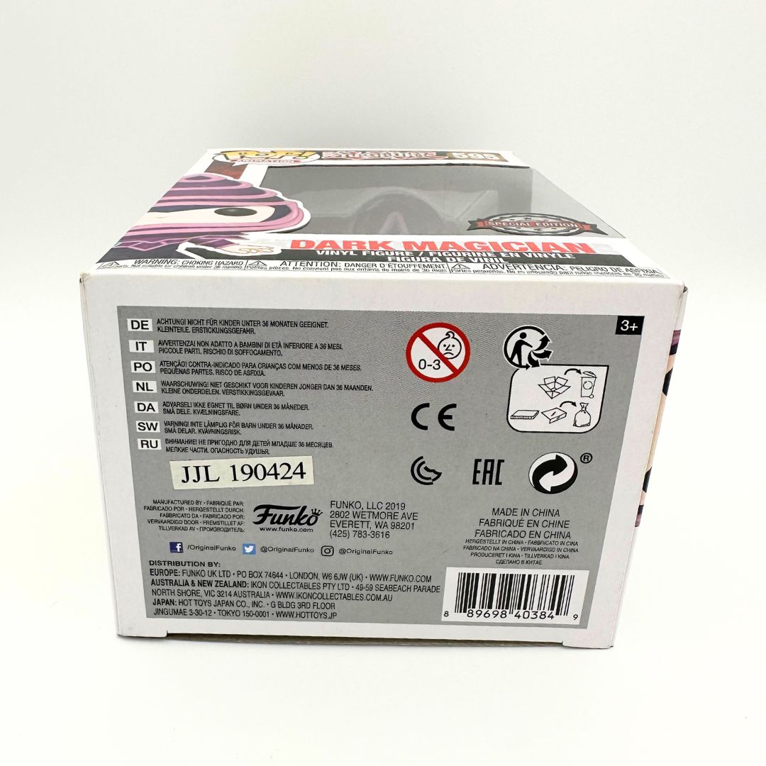 A photo of the bottom of the Dark Magician 595 Funko Pop including safety instructions and branding info