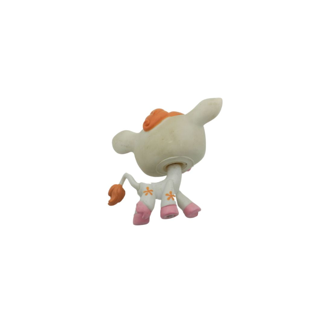 Small figurine of a character with orange hair and pink shoes on a white background