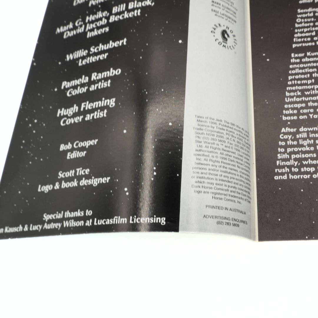 Open book with credits on a white background