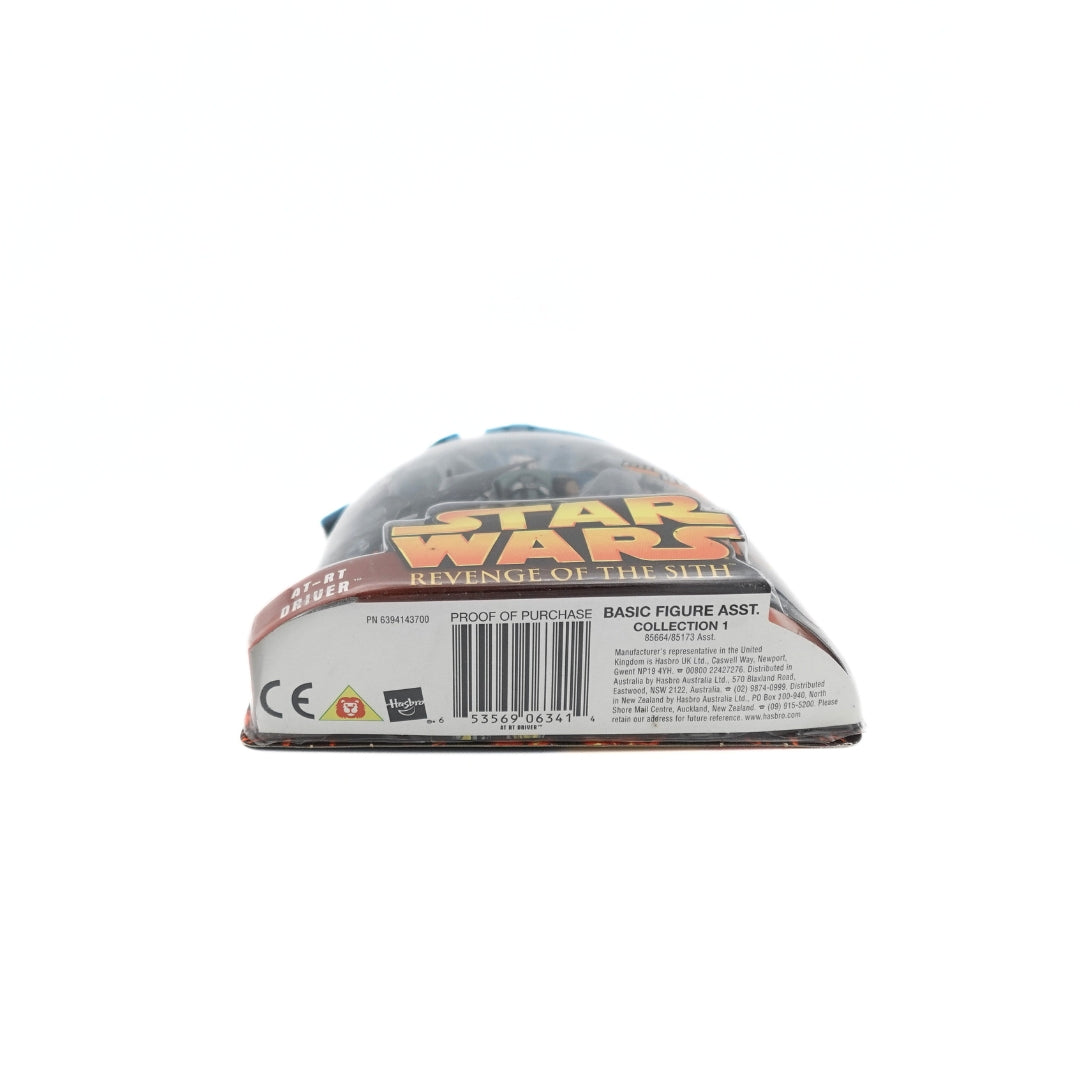 Barcode and manufacturer information on the underside of an AT-RT Driver figurine packaging