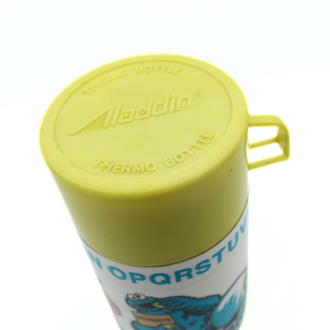 Yellow lid on a 1979 Sesame Street thermo bottle released by Aladdin