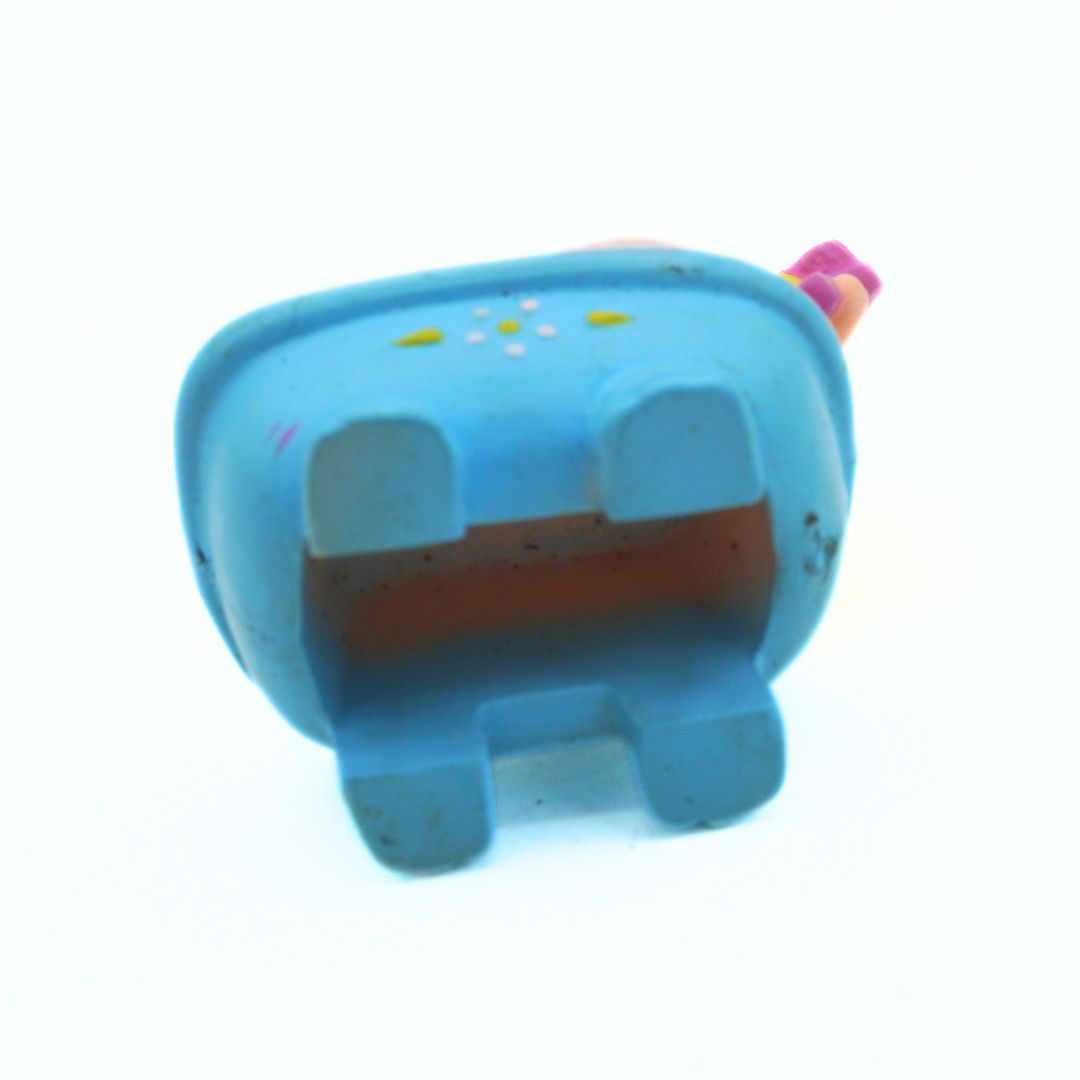 Blue toy figure on a white background