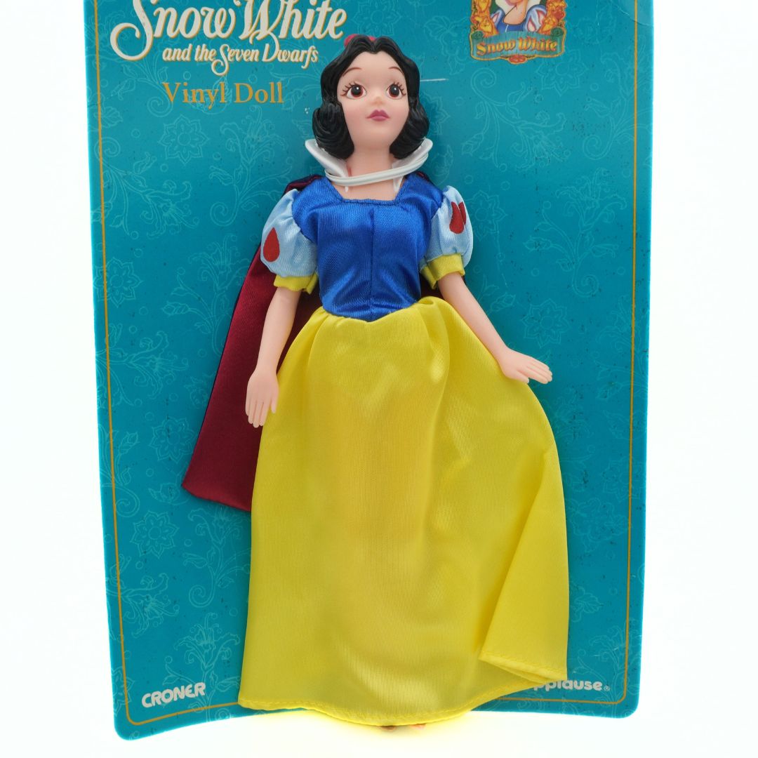 Snow White doll on a blue card with Disney branding