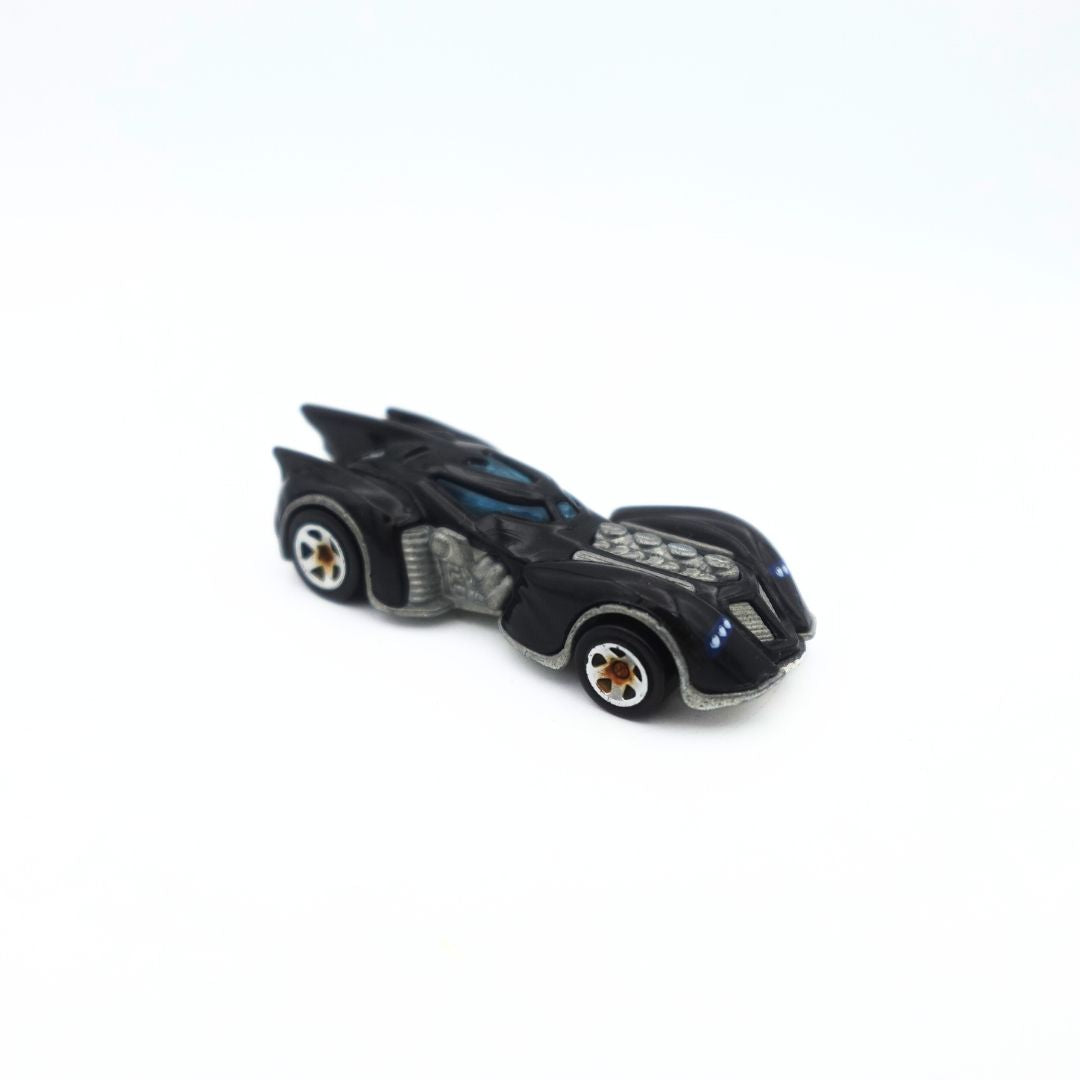 Side on photo of the 2010 Hot Wheels Arkham Asylum Batmobile diecast toy car featuring hot rod detailing