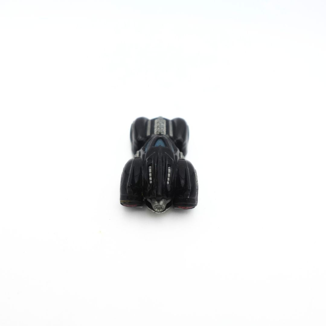 Photo of the back of the 2010 Hot Wheels Arkham Asylum Batmobile diecast toy car featuring hot rod detailing