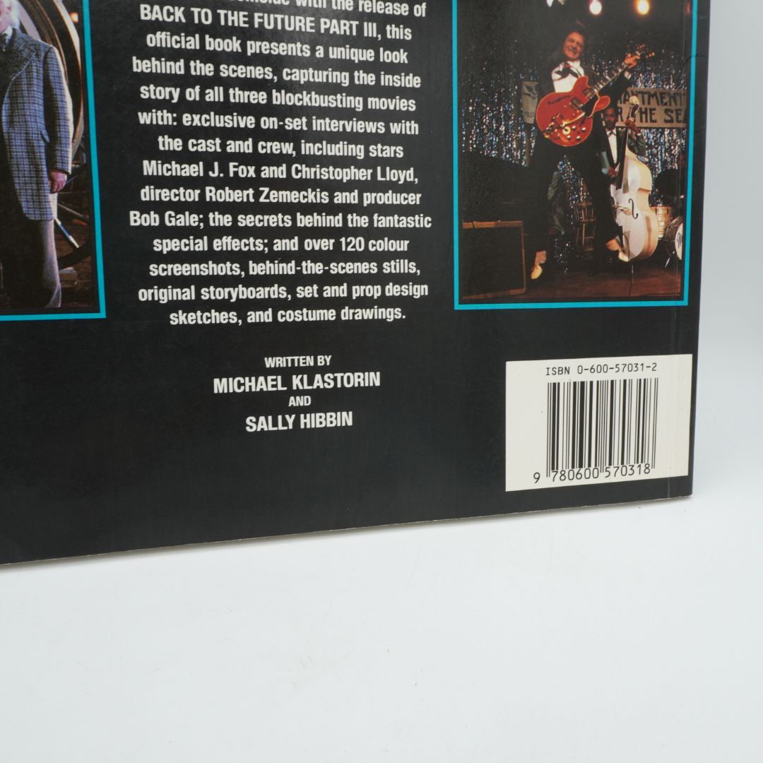 Back cover of a book with text and a barcode on a white background