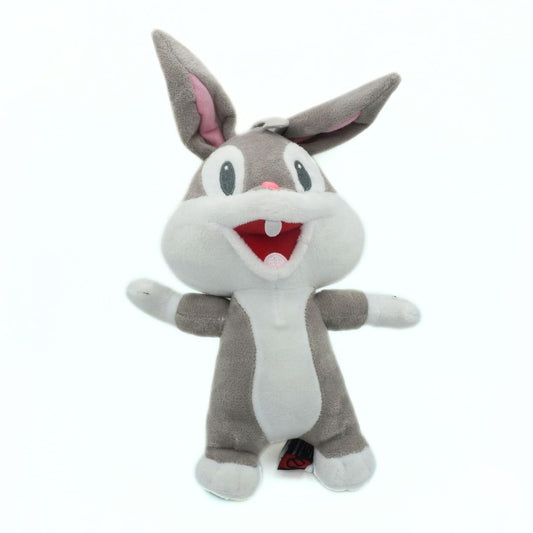 Plush toy of a baby Bugs Bunny plush with gray fur and red mouth on a white background