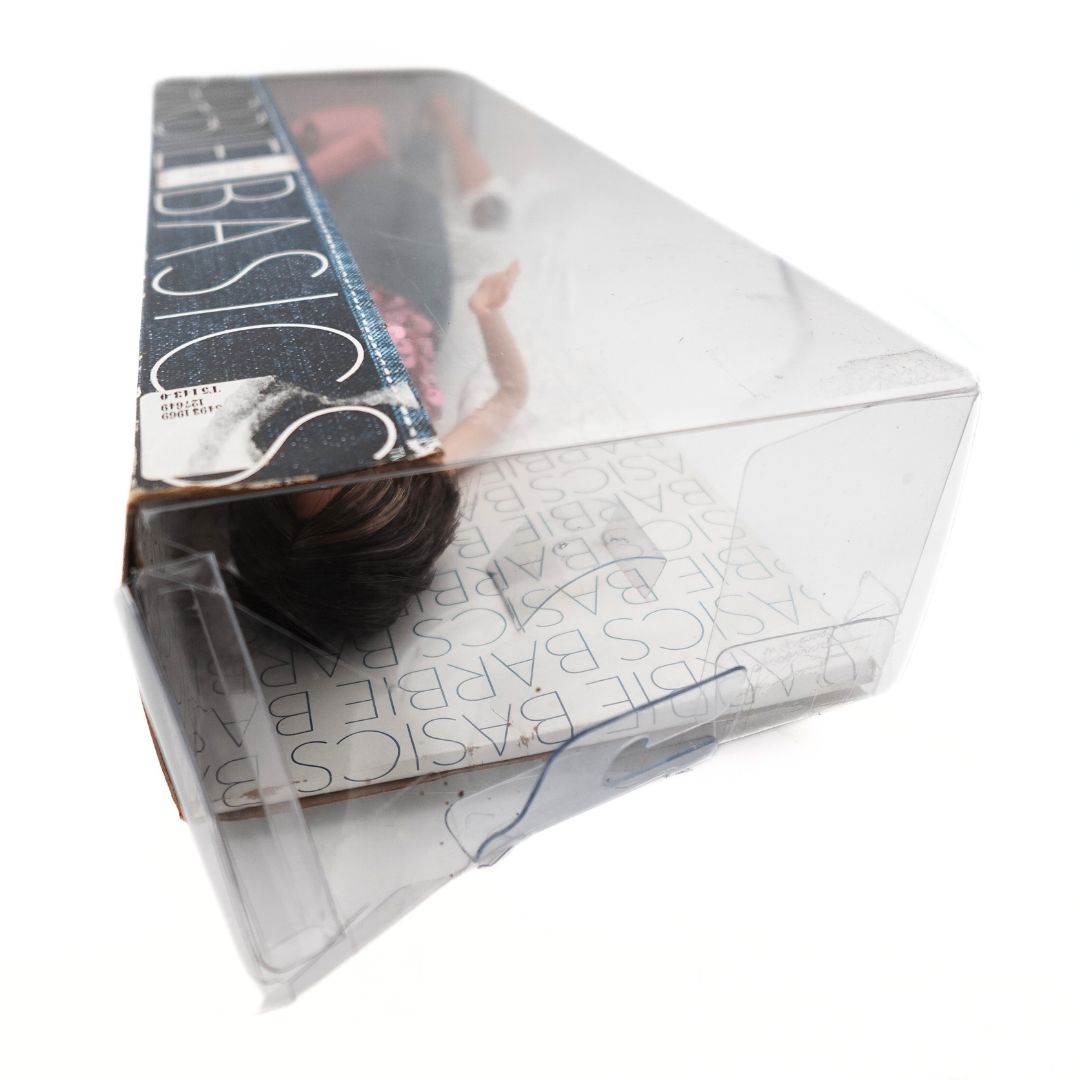 Top down phot of the Barbie Basics 02-002 box, showing damage to the plastic