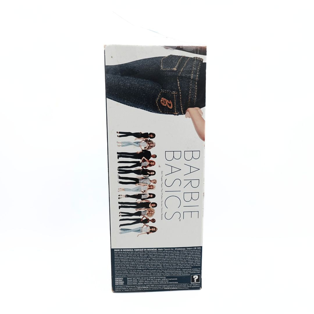 Photo of the back of the Barbie Basics #02-002 doll packaging showing the dolls in the range with a white and black colour palette