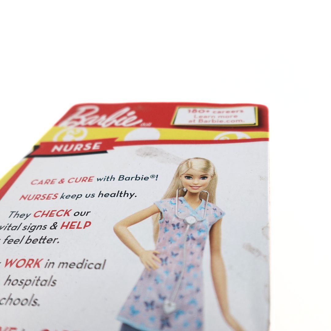 Marks to the back of a 2017 Nurse Barbie toy box