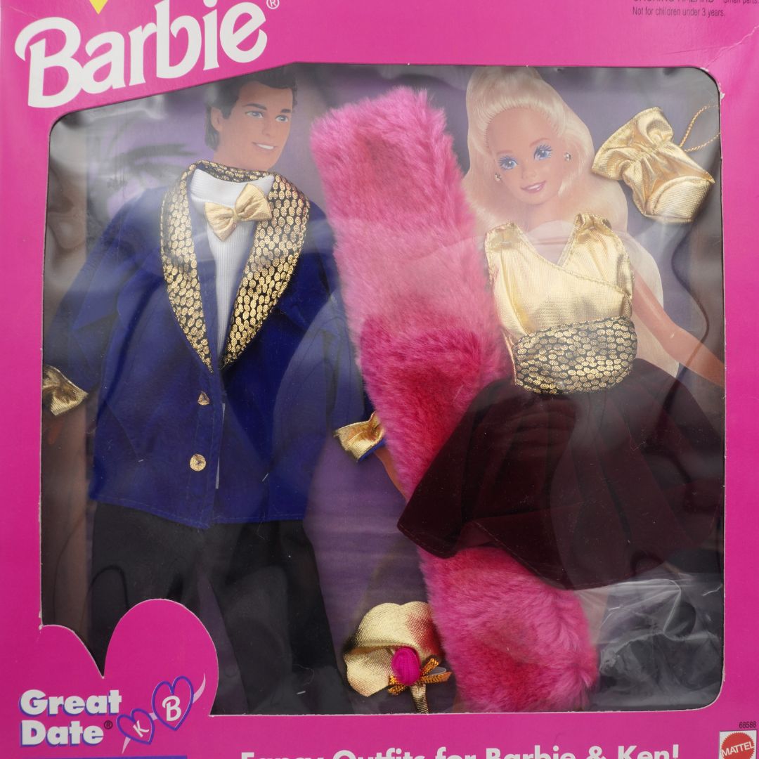 Closeup image of a vintage Barbie and Ken outfit set showing formal wear