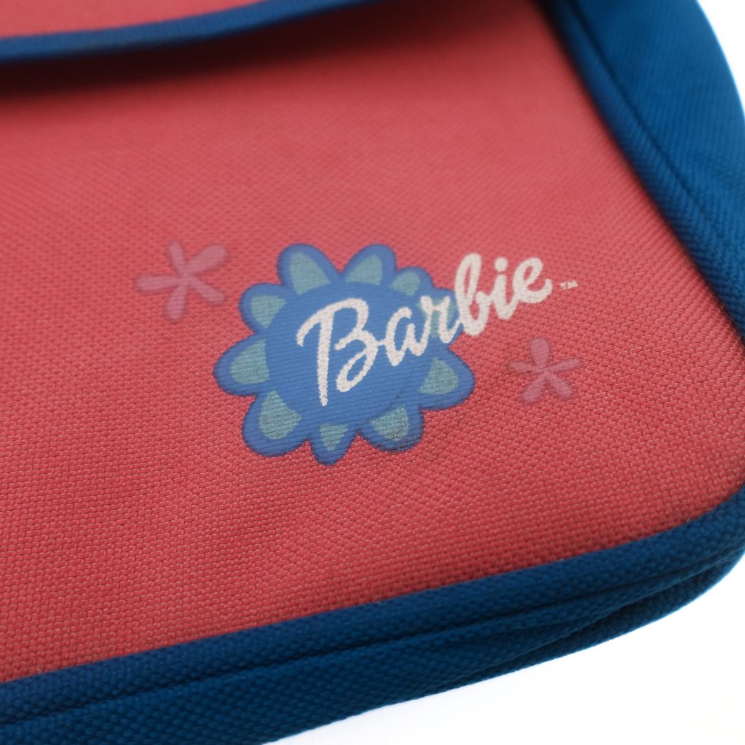 Logo on the bottom right corner of a 1999 pink and blue Barbie bag