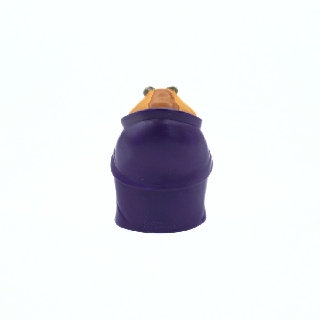 Photo of the back of a vintage Beauty and the Beast Beast figurine showing his brown hair and purple cloak