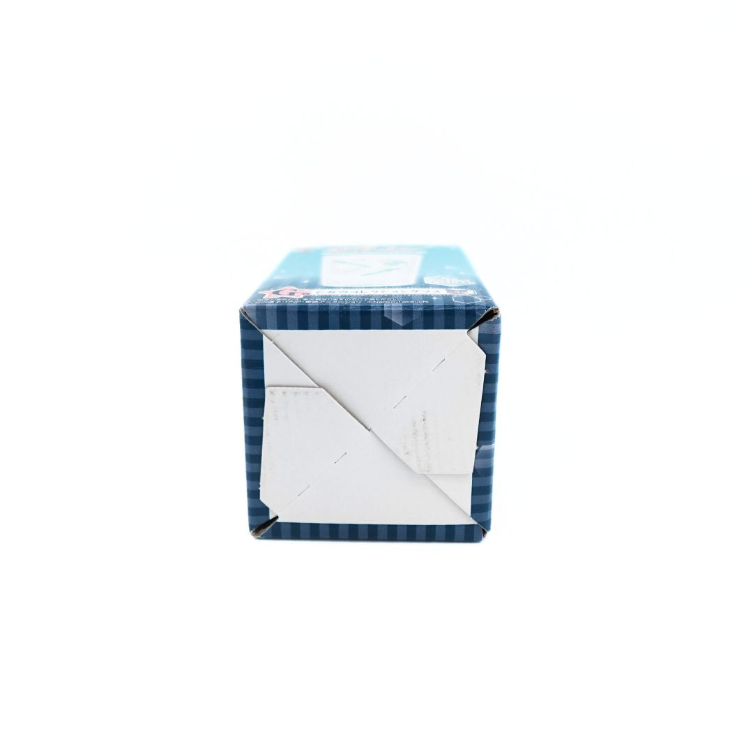 Sailor Scout box holding a clear, green and gold glass