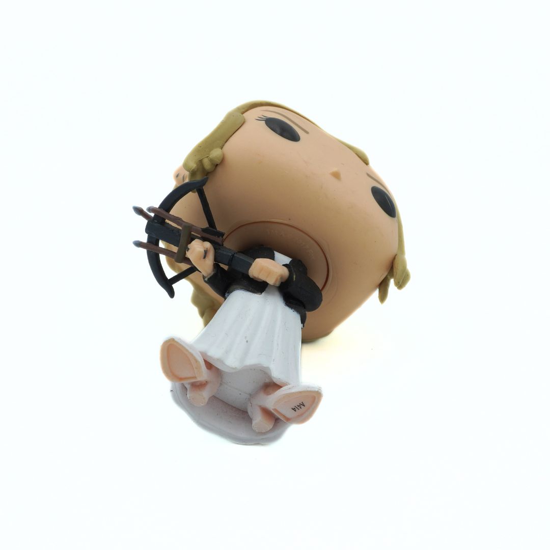 Figurine of a character with blonde hair and white dress on a white background