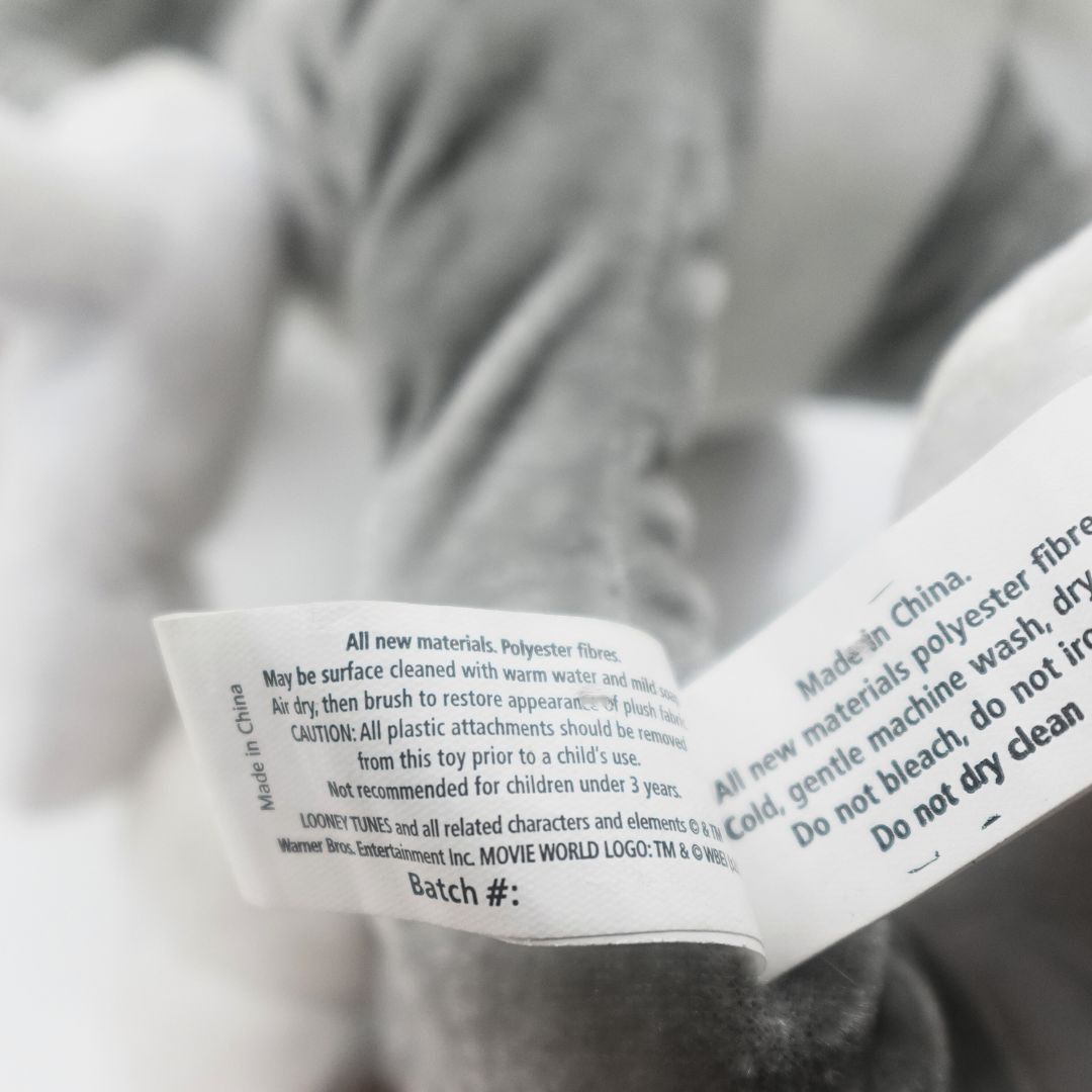 Tag on a Movie World Bugs Bunny plush featuring the safety and brand information