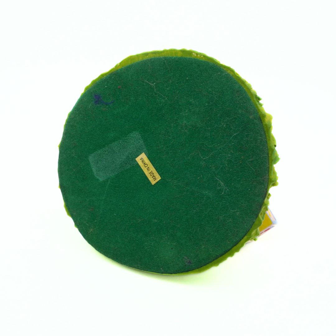 Green circular object with a label on a white background