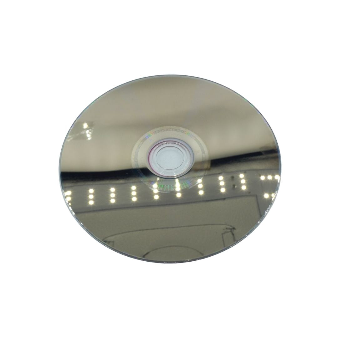 A reflective silver mirror disc with a small iridescent rainbow ring in the center, shown against a plain white background.