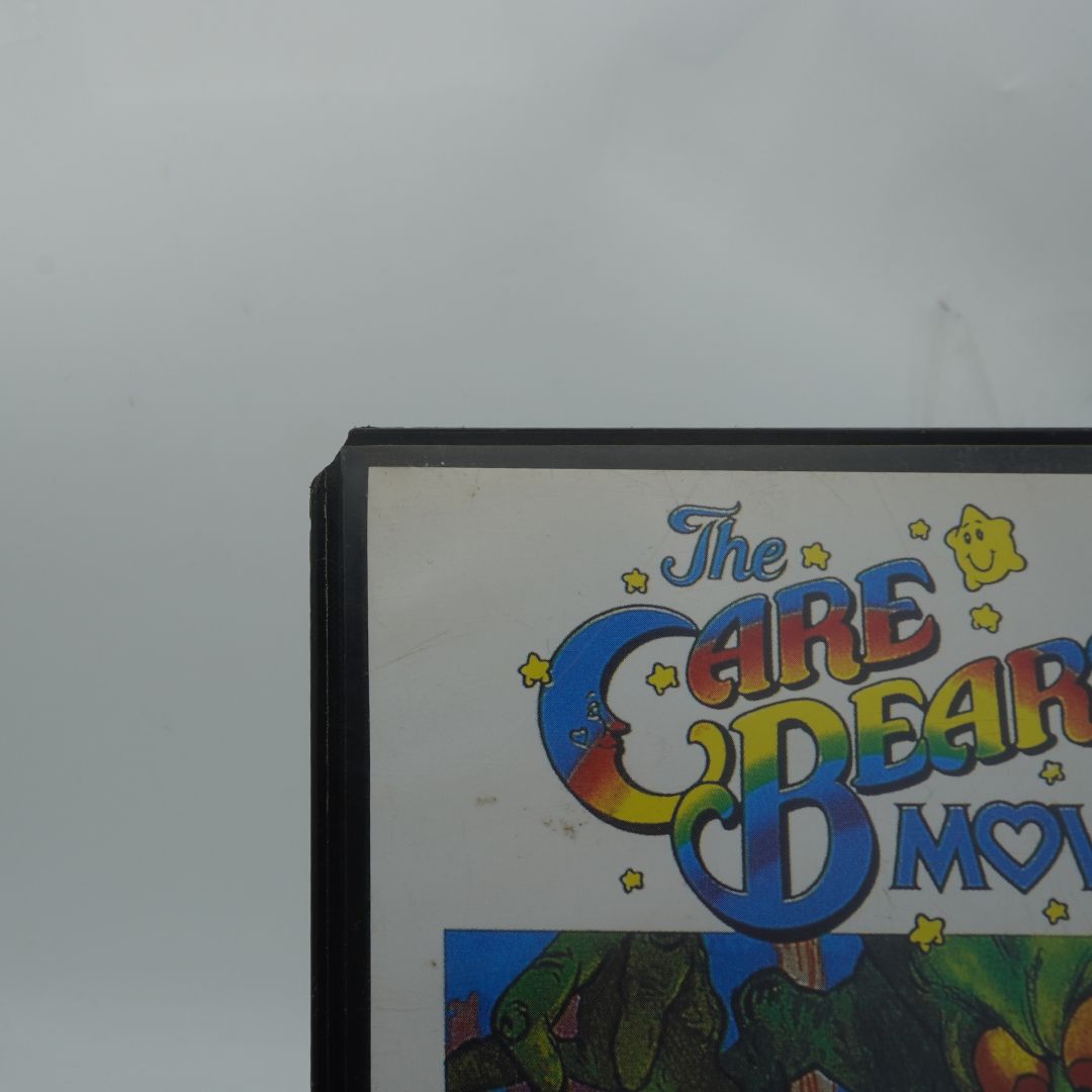 Corner of the tape case 'The Care Bear Movie' with colorful text and characters.
