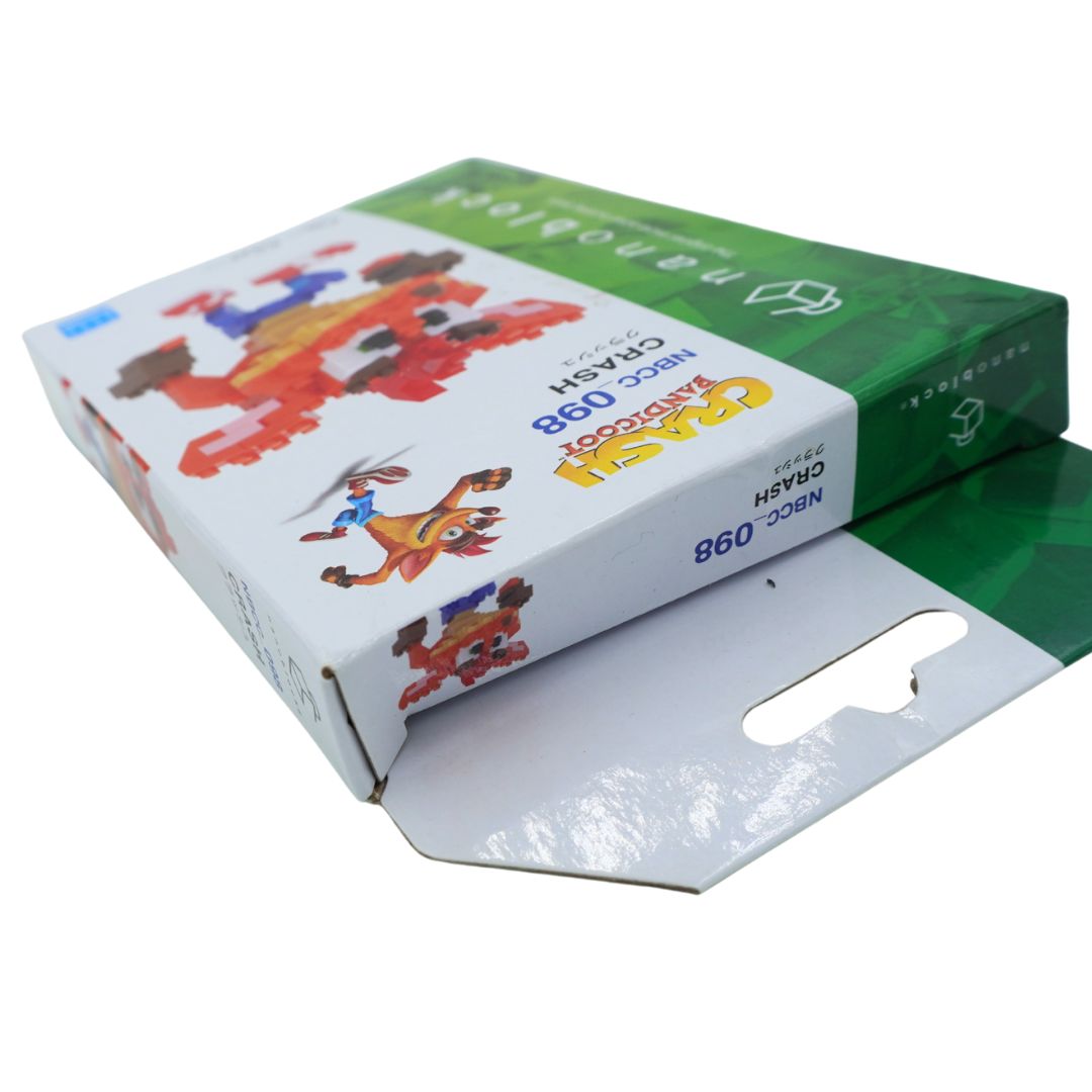 A box of NCC 098 Crash nanoblock, featuring colorful cartoon graphics of the character on a white background
