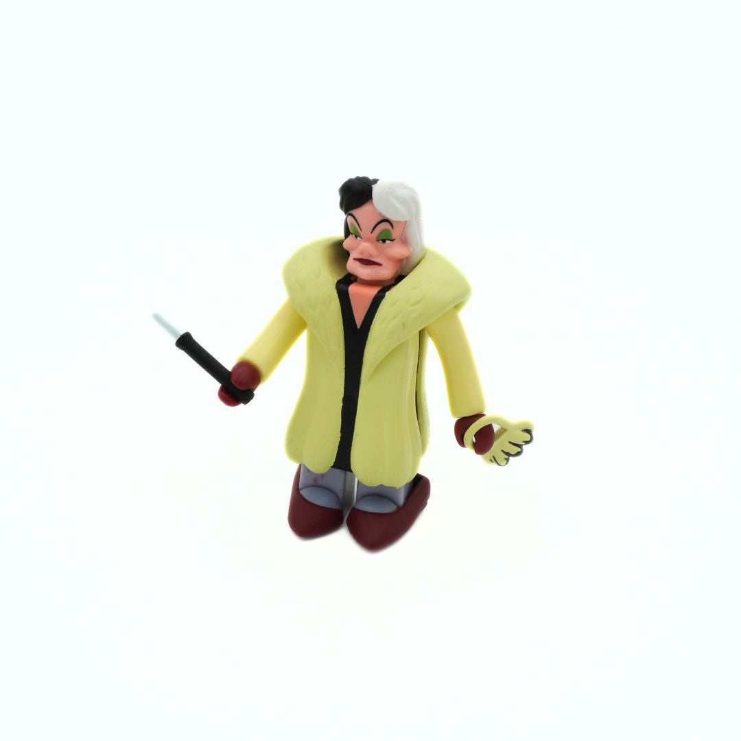 Vintage Disney Kubrick Cruella Deville mini figurine in a light yellow coat with red accessories