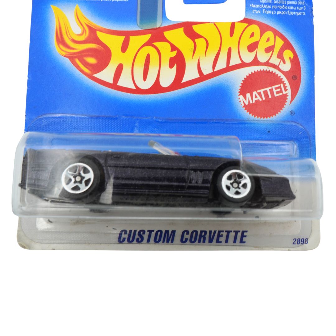 Hot Wheels Custom Corvette toy car in packaging with Hot Wheels logo.