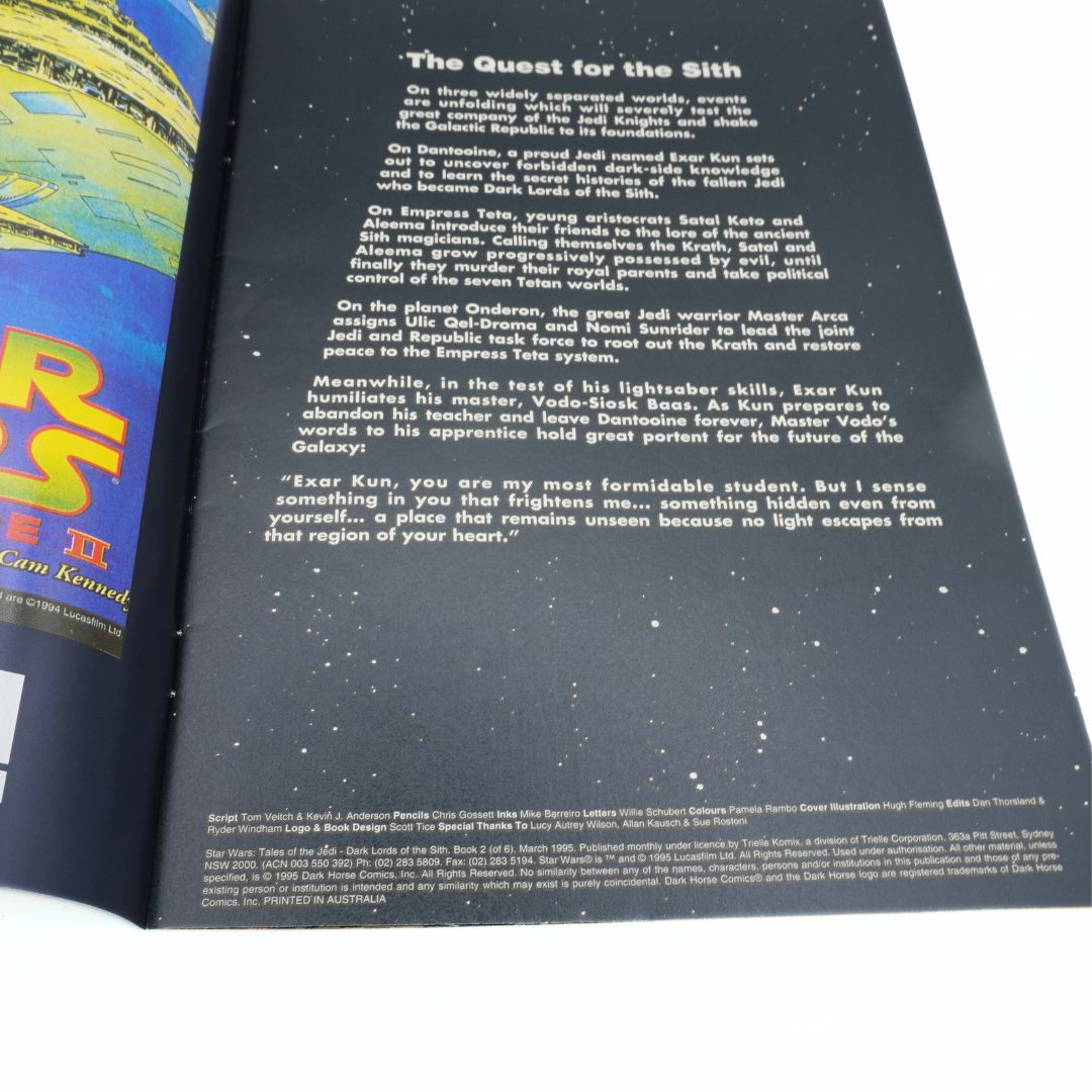 Star Wars book open to a page with text and a colorful illustration on the left.