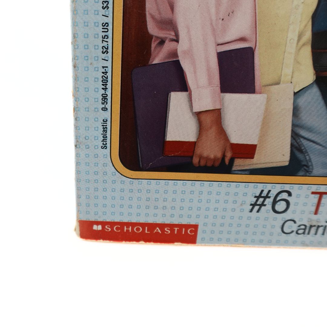 More creasing on the front cover of a 90s paperback book with Scholastic branding