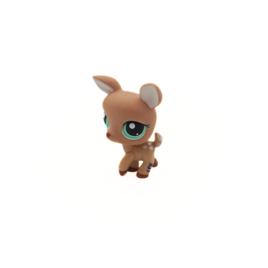 Small toy deer figure on a white background