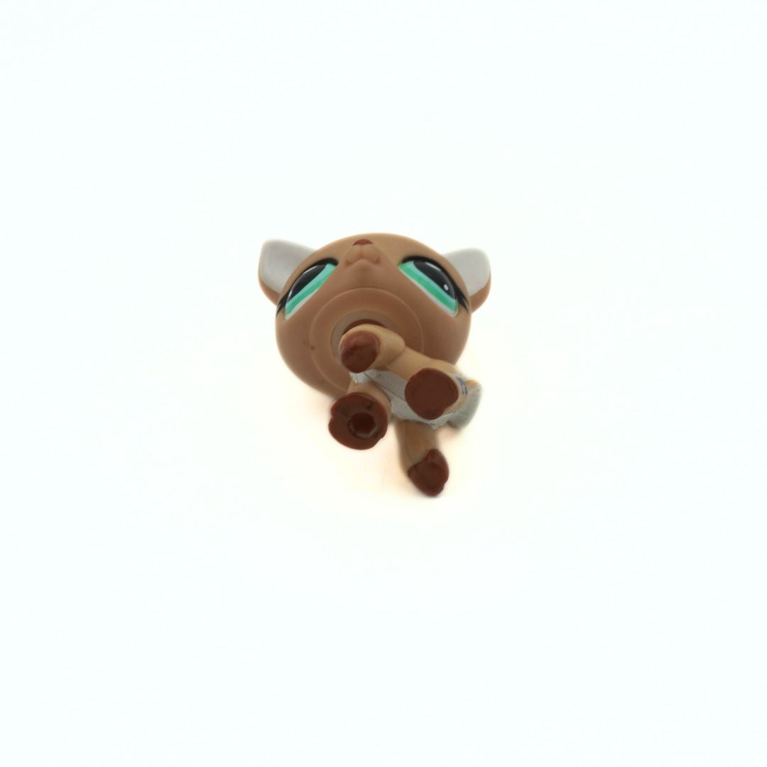 Small brown and gray toy figure on a white background