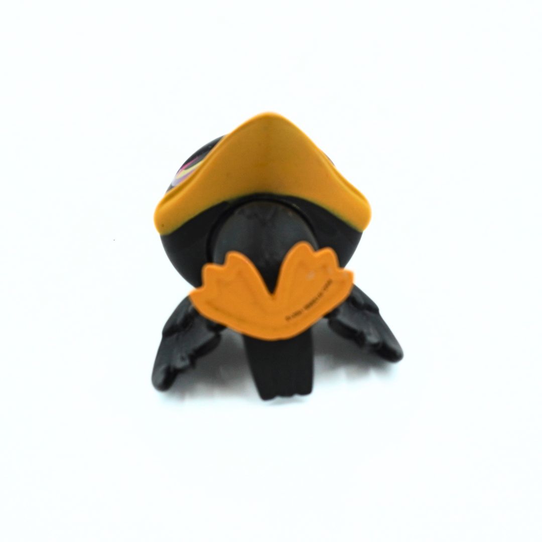 A small black and yellow toy bird figure, likely a raven or crow, photographed against a plain white background.