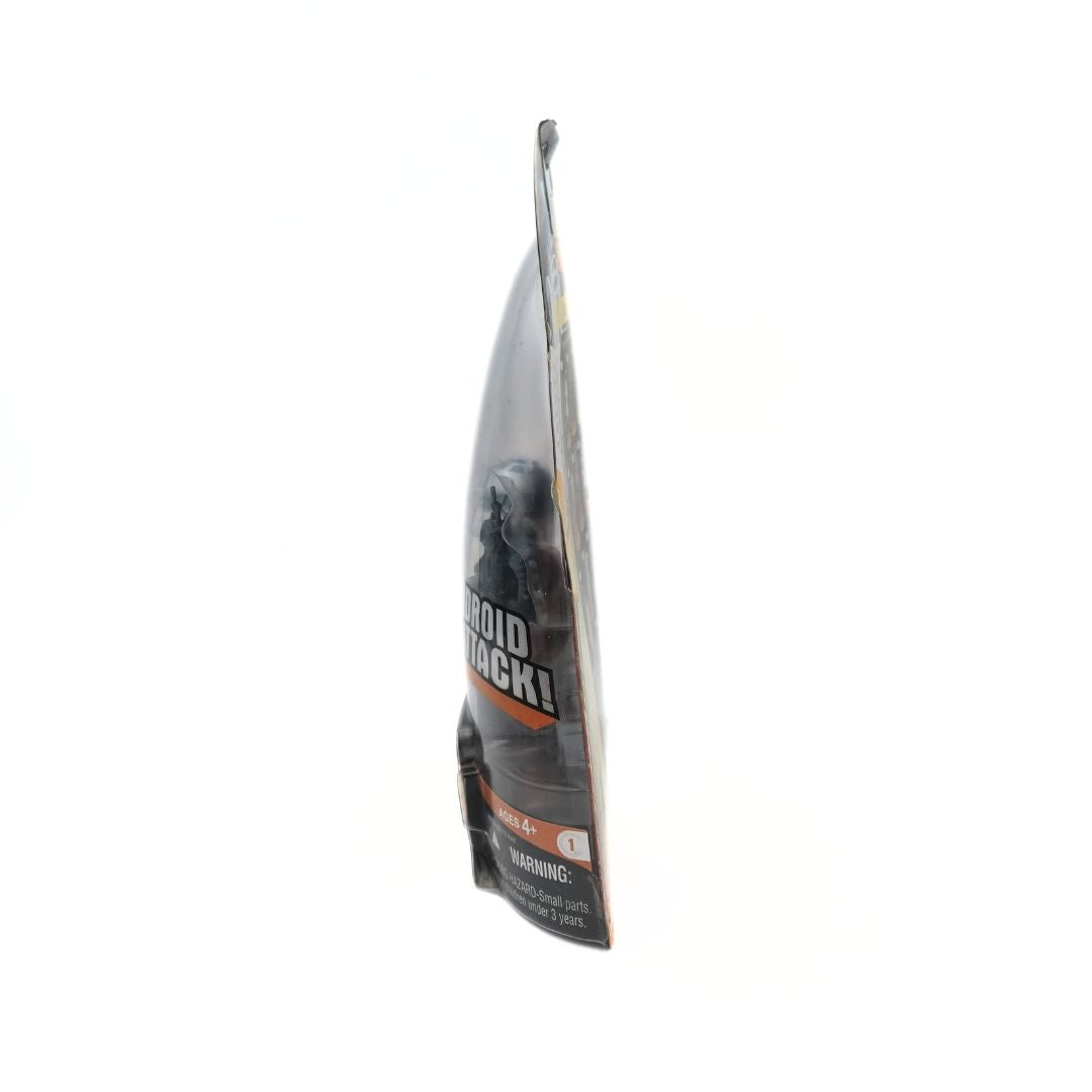 Side on photo of a vintage 2005 R2-D2 Star Wars toy in packaging