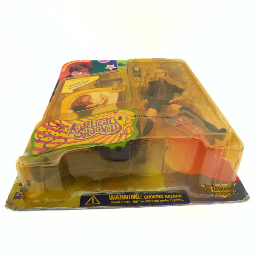 Photo of the underside of a 1999 Austin Powers Felicity Shagwell figure in packaging