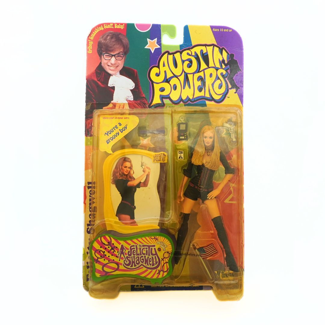 A 1999 Austin Powers Felicity Shagwell figurine still in its original packaging with accessories included