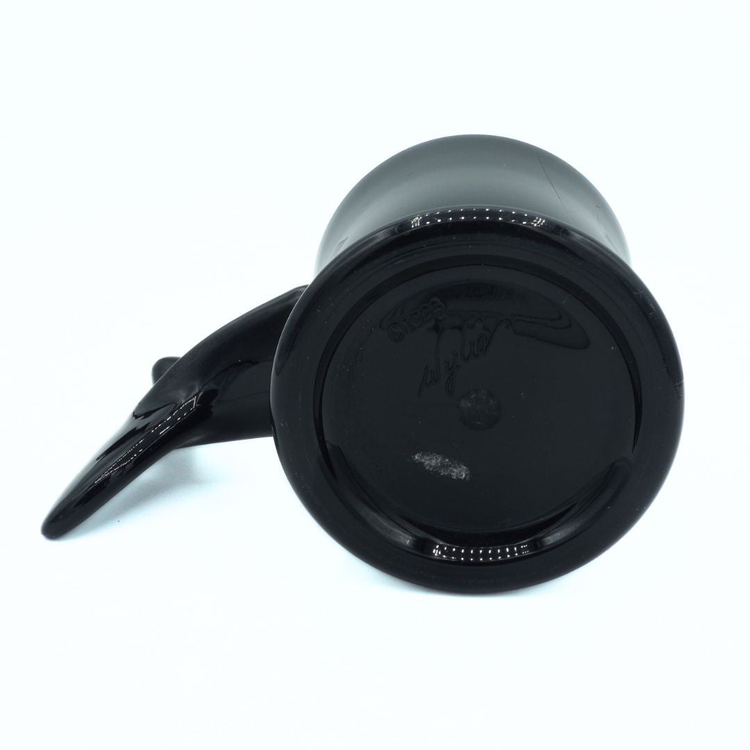 Black travel mug with handle on a white background